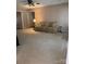 Cozy living room with a striped sofa, neutral carpet, and a ceiling fan for comfortable living at 165 Graceland Pl, Salisbury, NC 28146