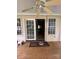 View of a porch with sliding glass doors, ceiling fan and wood flooring at 165 Graceland Pl, Salisbury, NC 28146