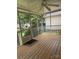 Spacious screened porch with wood flooring and ample natural light, perfect for outdoor enjoyment at 165 Graceland Pl, Salisbury, NC 28146