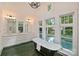Bathroom with dual sink vanity, bathtub overlooking pool and walk-in shower at 1804 Thomas Ave, Charlotte, NC 28205