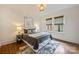 Bedroom with hardwood floors, neutral decor, and bright natural light at 1804 Thomas Ave, Charlotte, NC 28205