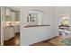 View of the kitchen with a wooden bar and white cabinets at 1804 Thomas Ave, Charlotte, NC 28205