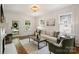 Cozy living room with natural light, comfortable seating, and hardwood floors at 1804 Thomas Ave, Charlotte, NC 28205