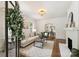 Bright living room featuring hardwood floors, fireplace, and arched doorway at 1804 Thomas Ave, Charlotte, NC 28205