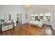 Spacious primary bedroom featuring hardwood floors and ensuite bathroom at 1804 Thomas Ave, Charlotte, NC 28205