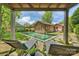 Relaxing backyard oasis featuring a pristine pool, brick pool house, and comfortable lounge chairs at 1804 Thomas Ave, Charlotte, NC 28205