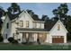 Beautiful two-story home with a covered porch, white siding, and a well-manicured lawn at 1807 Kennesaw Dr, Charlotte, NC 28216