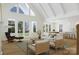 Bright living room with vaulted ceilings, large windows, and an open floor plan at 1807 Kennesaw Dr, Charlotte, NC 28216