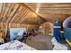 Spacious attic with wood paneling offers ample storage or flexible living space at 1870 Sloan Rd, Mt Ulla, NC 28125