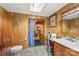 Practical bathroom with wood paneling and ample counter space, designed for everyday convenience at 1870 Sloan Rd, Mt Ulla, NC 28125