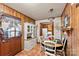 Charming dining area with wood paneling near the laundry area at 1870 Sloan Rd, Mt Ulla, NC 28125