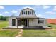 Charming exterior featuring a barn style design, offering a unique aesthetic and inviting curb appeal at 1870 Sloan Rd, Mt Ulla, NC 28125
