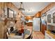 Charming eat-in kitchen with wood paneling and dining area is ready for mealtime at 1870 Sloan Rd, Mt Ulla, NC 28125