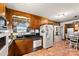 Well-lit kitchen featuring wood cabinets and modern appliances at 1870 Sloan Rd, Mt Ulla, NC 28125