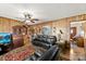 Spacious living room featuring wood paneling and classic furniture at 1870 Sloan Rd, Mt Ulla, NC 28125