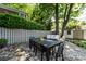 Picturesque backyard patio with wooden dining and seating furniture, ideal for outdoor gatherings at 2033 Charlotte Dr, Charlotte, NC 28203