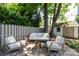 Backyard patio with an outdoor seating area and fire pit, creating a relaxing space at 2033 Charlotte Dr, Charlotte, NC 28203