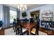 Open dining room with sophisticated decor, leading into a cozy living area with a fireplace at 2033 Charlotte Dr, Charlotte, NC 28203