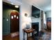 Elegant entryway featuring dark hardwood floors, and an arched wood doorway at 2033 Charlotte Dr, Charlotte, NC 28203