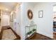 Elegant hallway with hardwood floors, decorative mirror, and stylish console table at 2033 Charlotte Dr, Charlotte, NC 28203