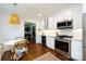 Well-appointed kitchen with a breakfast nook, stainless steel appliances, and white cabinetry at 2033 Charlotte Dr, Charlotte, NC 28203