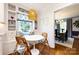 Breakfast nook adjacent to the dining room features a built in bench, light fixture, and natural light at 2033 Charlotte Dr, Charlotte, NC 28203
