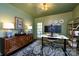 Inviting home office with custom storage, stylish decor, and ample workspace at 2033 Charlotte Dr, Charlotte, NC 28203