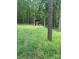 Rustic outbuilding in wooded area, great privacy; features include unique design and natural surroundings at 208 James Dr, Cleveland, NC 27013