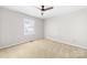 Bright, spacious bedroom with ceiling fan and natural light at 22330 Torrence Chapel Rd, Cornelius, NC 28031