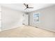 Bright, spacious bedroom with ceiling fan, closet, and natural light at 22330 Torrence Chapel Rd, Cornelius, NC 28031