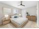 Cozy bedroom with a ceiling fan and a large window for natural light at 22330 Torrence Chapel Rd, Cornelius, NC 28031