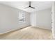 This bedroom is bright and spacious with a window and ceiling fan at 22330 Torrence Chapel Rd, Cornelius, NC 28031