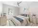 Bright bedroom with ceiling fan and a large window for natural light at 22330 Torrence Chapel Rd, Cornelius, NC 28031