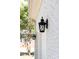 Exterior light fixture on a brick wall at 22330 Torrence Chapel Rd, Cornelius, NC 28031