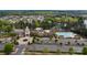 The aerial view showcases a community center with a pool, parking, and landscaped grounds by a serene lake at 23147 Whimbrel Cir, Fort Mill, SC 29707
