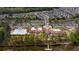 An aerial view of the clubhouse, pool, and community, showcasing the proximity to the lake and golf course at 23147 Whimbrel Cir, Fort Mill, SC 29707