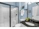 Bathroom featuring a shower and granite countertop vanity, combining functionality with style at 23147 Whimbrel Cir, Fort Mill, SC 29707