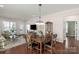 Open floor plan with dining area, stylish decor, and seamless flow into living spaces at 23147 Whimbrel Cir, Fort Mill, SC 29707