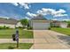 Beautiful single-story home featuring a spacious driveway, two-car garage, and well-maintained lawn at 23147 Whimbrel Cir, Fort Mill, SC 29707