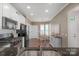 Bright kitchen with stainless steel appliances, granite countertops, and a breakfast nook at 23147 Whimbrel Cir, Fort Mill, SC 29707