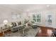 Elegant living room with natural light, stylish furnishings, and hardwood floors at 23147 Whimbrel Cir, Fort Mill, SC 29707