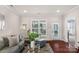 Comfortable living room with hardwood floors, a plush sofa, and a view of the outdoors at 23147 Whimbrel Cir, Fort Mill, SC 29707