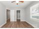 This bedroom has hardwood floors and a window for natural lighting; it also has access to a bathroom at 2322 Hedgewood Cir, Gastonia, NC 28052