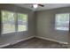 Bedroom with two windows for natural light and a ceiling fan for added comfort at 2322 Hedgewood Cir, Gastonia, NC 28052