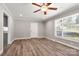 This bedroom features a large window, hardwood floors, and access to a closet and backyard at 2322 Hedgewood Cir, Gastonia, NC 28052