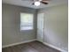 Cozy bedroom featuring wood-look floors, neutral paint, and a ceiling fan for added comfort at 2322 Hedgewood Cir, Gastonia, NC 28052