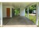 Large carport featuring a concrete floor, neutral paint, and offers access to the side yard at 2322 Hedgewood Cir, Gastonia, NC 28052