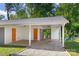 A modern carport features two garage doors and an entrance to the home at 2322 Hedgewood Cir, Gastonia, NC 28052