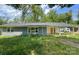 Charming single story home with a brick exterior, large covered parking area and a large front yard at 2322 Hedgewood Cir, Gastonia, NC 28052