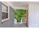 View of the front porch featuring a painted gray brick wall and access to the front yard at 2322 Hedgewood Cir, Gastonia, NC 28052